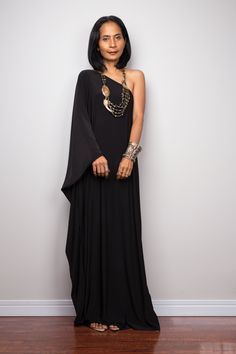 "Black one shoulder dress, Long black kaftan dress, Off shoulder evening dress, black cocktail dress, black party dress, reversible dress PRODUCT SIZE : Free Size * Chest : 40\" will stretch to 44\" * Waist : 40\" will stretch to 44\" * Hips : 40\" will stretch to 44\" * Sleeve length : 23\" * Length : 57\" - 58\" from shoulder to hem (measured when laying flat) MATERIAL : * ITY (polyester jersey) > soft and comfortable to wear, not as slippery as spandex. NOTE : * Model chest : 32\", waist : Chic Evening Maxi Kaftan, Bohemian One Shoulder Evening Dress, Chic Long Dress Kaftan For Party, Black Bohemian Maxi Dress For Party, Chic Party Kaftan In Maxi Length, Chic Party Kaftan Maxi Length, Black Bohemian Maxi Dress For Evening, Chic Party Long Dress Kaftan, Black Bohemian Evening Maxi Dress