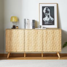 the sideboard is made out of wood and has an interesting design pattern on it