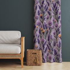 a living room with a chair and purple curtains