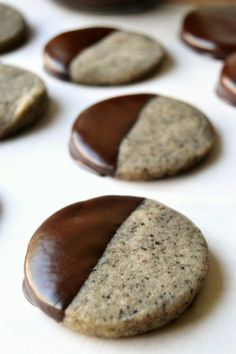 some cookies with chocolate on them sitting on a table