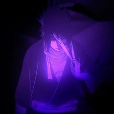 a person in the dark with a purple light