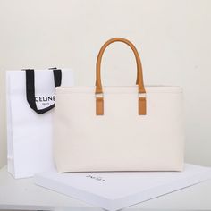 Size: 44cm*32cm*6cm It comes with Dust box, Care manual, Tag, and Paper bag. Luxury White Rectangular Canvas Bag, Large Modern Box Bag With Handles, Modern Large Box Bag, Canvas Top Handle Box Bag For Shopping, Rectangular Box Bag With Leather Handles For Shopping, Beige Tote Box Bag With Leather Handles, Canvas Box Bag With Double Handle For Shopping, Canvas Double Handle Box Bag For Shopping, Double Handle Canvas Box Bag For Shopping