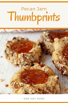 there are cookies with jam on them and the title reads, pecan jam thumbprints one not oven