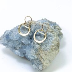 This top selling design is the perfect everyday earring for pearl lovers who are looking for something unique. 14k gold filled hoops are hand forged and textured with lines creating a sunshine effect, with tiny freshwater seed pearls stretching across the tops. From our Baroque Collection. #anyoccasion #jewlerystaple #freshwaterpearl •14k gold filled •Freshwater pearl •Dimensions: 5/8 x 1" Everyday Hammered 14k Gold Filled Earrings, Everyday Pearl Earrings Wire Wrapped, Everyday Handmade Pearl Earrings, Everyday Gold Wire Wrapped Pearl Earrings, Handmade 14k Gold Filled Pearl Earrings For Everyday, Selling Design, Gold Filled Hoops, Seed Pearl, Jewelry Repair