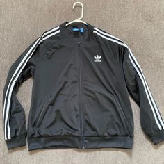 Adidas Track Jacket Fits Like A Men’s Medium But Think It’s Kids Xl. Worn Once, Looks Brand New. Adidas Outerwear With Three Stripes For Outdoor Activities, Adidas Three Stripes Outerwear For Outdoor Activities, Adidas Winter Windbreaker, Long Sleeve Outerwear With Three Stripes For Outdoor Activities, Adidas Winter Windbreaker With Three Stripes, Winter Track Jacket With Three Stripes For Outdoor Activities, Casual Three Stripes Track Jacket With Long Sleeves, Adidas Winter Outerwear With Three Stripes, Winter Adidas Stripes Sportswear Outerwear