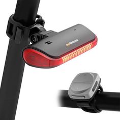 the bike light is on and next to it's rear view mirror, which also has a camera attached