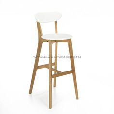 a wooden stool with a yellow seat on a white background in front of a white backdrop