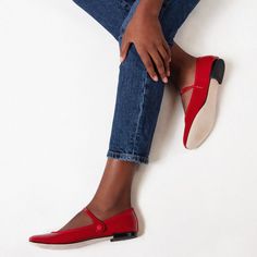 An elegant fusion of timeless style and modern comfort. These flats are meticulously crafted from high-gloss, patent leather in a vibrant red hue that instantly elevates any outfit. Featuring a classic round toe design, they offer ample space for your feet to ensure all-day comfort. The iconic Mary Jane strap adds a nostalgic touch while providing a secure fit. With their versatile silhouette, these shoes can effortlessly transition from day to night, from office meetings to weekend outings. Mak Red Round Toe Ballet Flats With Rubber Sole, Red Ballet Flats With Rubber Sole, Leather Ballet Flats With Red Sole And Round Toe, Red Leather Ballet Flats With Red Sole, Red Leather Ballet Flats With Flat Heel, Leather Ballet Flats With Red Sole, Red Ballet Flats With Removable Insole And Round Toe, Red Ballet Flats With Removable Insole, Red Leather Ballet Flats With Leather Sole