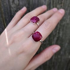 ---------------------------------------- THE PRODUCT Raw ruby ring. This is a handcrafted genuine and natural large raw ruby gemstone ring. We make it from high quality natural rubies that have a bright red color and is apx. 5 cts. The stone is tablet cut to show off all it's colors and beautiful imperfections and make for a unique look. Each stone has different markings and tones reminding you that not only is this truly a piece of the earth but it is one of a kind and yours is completely uniqu Square Cut Red Ruby Ring Gift, Red Square Cut Ruby Ring Gift, Red Square Cut Ruby Ring, Square Cut Ruby Ring In Red, Square Cut Ruby Ring, Raw Ruby, Natural Ruby Ring, Natural Emerald Rings, Ring Square