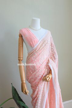 Beautiful Soft Chikaankari Saree in georgette fabric. It's very soft and sits very well on your body. It includes unstitched georgette peach plain blouse. Suitable in any asian occasions. Please message for more informations. Peach Blouse Piece With Cutdana Traditional Drape, Peach Georgette Blouse Piece With Zari Work, Semi-stitched Peach Blouse Piece With Zari Work, Peach Blouse Piece With Resham Embroidery For Saree, Elegant Peach Blouse Piece With Pallu, Semi-stitched Blouse Piece With Pallu In Peach, Peach Georgette Blouse Piece With Dupatta, Spring Georgette Saree With Unstitched Blouse, Peach Saree Blouse Piece With Resham Embroidery