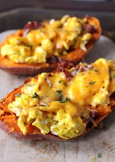 two sweet potatoes with scrambled eggs on them and the words dinner leftovers breakfast stuffed sweet potatoes