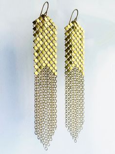 Classic gold mesh earrings fringed with long graduated panels of 14k gold filled chain. Iconic metal mesh is reclaimed from a vintage purse (circa 1940s-80s). Long gold mesh fringed earrings hang 3” from the 14k gold filled ear wires. Each earring signed with our logo link. Mesh Earrings, Fringed Earrings, Vintage Purse, Metal Mesh, Classic Gold, Fringe Earrings, Gold Filled Chain, Ear Wires, Gold Filled