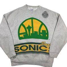 90s Seattle Sonics vintage NBA Crewneck sweatshirt. Tagged as a large. 24 inches pit to pit, 27.5 inches long. Stitched graphic. Lee-sport/nutmeg Mills Collab. Rare find. No rips, tears, or stains. Smoke and pet free home. Vintage NBA. Seattle. Super sonics. Throwback Crew Neck Sweatshirt For Streetwear, Gray Hip Hop Crew Neck Sweatshirt, Gray 90s Crew Neck Sweatshirt, 90s Gray Crew Neck Sweatshirt, 90s Style Gray Crew Neck Sweatshirt, Urban Graphic Print Sweatshirt For Sports Events, Urban Style Crew Neck Sweatshirt For Sports Events, Urban Crew Neck Sweatshirt For Fan Merchandise, Athletic Heather Sweatshirt With Graphic Print For Streetwear