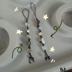 the earrings are decorated with beads and stars