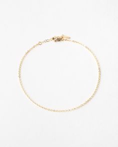 "A whisper, not a shout. Add a dainty flash of gold to your everyday look with this tiny, shiny anklet. Add a few meaningful charms or personalized disks for a look that's all yours!  Every piece is handcrafted and hand-personalized with love in La Conner, WA, using 90% recycled and 100% ethically sourced raw materials from the USA--because it's better that way. Includes free gift-ready packaging (featuring a care card and traditional letterpress goodies made by my dad)!  MATERIALS: * Gold = 14k Minimalist Gold Chain Bracelet With Rolo Chain, Gold Minimalist Chain Bracelet With Rolo Chain, Minimalist Gold Chain Anklets, Minimalist Gold Rolo Chain Bracelet, Gold Minimalist Rolo Chain Bracelet, Minimalist Adjustable Chain Anklet, Minimalist Gold Chain Anklets As Gift, Minimalist Gold Anklet With Adjustable Chain, Everyday Gold Chain Anklets