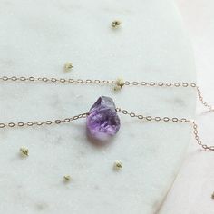 Amethyst in its most raw state. These stones come straight from Africa and their high-quality makes the Amethyst a pure clarity that can't be compared. This pendant necklace is the perfect gift for a February birthstone present, Christmas gift, or just snag it for yourself! (you deserve it♥) ♥ M A T C H I N G E A R R I N G S ♥ Find the matching Raw Amethyst earrings here: https://www.etsy.com/listing/707923896/amethyst-earrings-studs-february?ref=shop_home_active_12&pro=1&frs=1 *Message Purple Amethyst Necklace With Raw Stone, Dainty Amethyst Crystal Necklace For Gift, Purple Raw Stone Necklaces For Healing, Amethyst Raw Stone Necklace For Healing, Purple Raw Stone Necklace For Gift, Purple Amethyst Jewelry With Raw Stones, Amethyst Earrings Studs, Raw Amethyst Crystal, February Birthstone Necklace