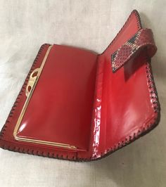 "Nice looking 1970's patch work top stitch red and black reptile leather wallet and checkbook holder. In very good vintage condition. Inside is bright red leather. Measurements are; 7\" x 3 1/4\" Feel free to convo me with any further questions. Thank you for your interest." Patch Work Top, Vintage Red Bifold Wallet, Brown Crocodile Pattern Business Wallet, Red Vintage Leather Wallets, Vintage Red Rectangular Clutch, Reptile Accessories, Red Leather Wallet With Card Slots, Reptile Skin, Quartz Crystal Jewelry