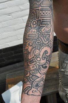 a man with a tattoo on his arm