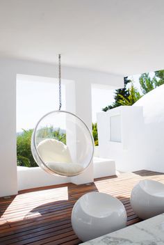 a hanging chair in the middle of a room