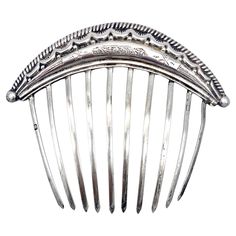 This hair comb was handcrafted in the 1840's, the engraving in the centre is typical for the design of the second half of Louis Philippe. The design of this hair comb features a grooved edged terminating in half balls on either side. Underneath the outer ornament we see an engraved garland motif decreasing in size towards the edges. under the garland motif we see a repetition of the ball motif, also decreasing in sizer towards the edges. This silver comb is marked with the head of minerva accomp 19th Century Hair, Silver Hair Comb, Hair Adornments, Louis Philippe, Comb Hair, Objet D'art, Hair Ornaments, Silver Hair, Hair Comb