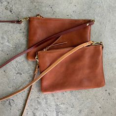 This is the perfect simple everyday leather crossbody bag sized for just the essentials! Slightly larger than our small clutch, and with a removable crossbody strap, this simple yet functional bag turns into an elegant evening clutch! It’s the perfect sightseeing travel bag for your next trip, as it securely zips closed, and easily holds your phone, passport, keys, small wallet, sunglasses, and a bit of makeup and can be worn across your body for hands free traveling. Its unfussy and minimalist Versatile Clutch Bag With Smooth Grain, Everyday Soft Leather Crossbody Clutch, Soft Leather Crossbody Clutch For Everyday, Classic Soft Leather Crossbody Clutch, Classic Everyday Crossbody Clutch, Everyday Cognac Clutch Bag, Chic Travel Clutch With Smooth Grain, Smooth Grain Clutch Shoulder Bag For Everyday Use, Everyday Use Clutch Shoulder Bag