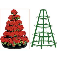 a christmas tree shaped planter with red flowers