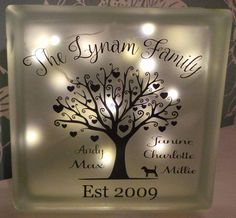 the illuminated family tree sign has hearts on it