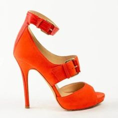 The Leona Sandals From Jimmy Choo Are Made In An Orange Nubuck Leather, And Feature Tonal Smooth Leather Trim, A Stiletto Heel, A Rounded Peep Toe, Gold-Tone Buckled Straps, And Leather Lining And Insoles. Condition: Great; Wear On Outsoles, Light Toe Markings, Some Scuffing On Upper. Size: 38.5 Approximate Measurements: Insole Length: 9.75” (25 Cm) Heel Height: 4.75” (12 Cm) Platform Height: 0.5” (1 Cm) Composition: 100% Leather. Orange Platform Heels With Round Toe, Orange Heels With 4-inch Heel And Round Toe, Chic Orange Heels With 4-inch Heel, Orange 4-inch Heel Summer Heels, Orange Synthetic Heels With 4-inch Heel, Orange Heels, Nubuck Leather, Platform Sandals, Leather Trims