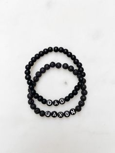 Listing is for one (1) bracelet containing 6mm black lava beads or matte black beads and black/white letter or number beads. This bracelet stretches to fit small to medium sized wrists (approximately 7 inches long). Size customization available free of charge - leave your desired dimensions in the comment section with your order.  Please email me with any questions: sarahndipityjewelry@gmail.com. Number Beads, Boys Bracelets, Best Friendship, White Letters, Lava Bead, Initial Bracelet, Name Bracelet, Personalized Bracelets, Black Beads