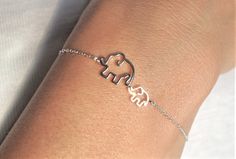 "Cute Elephants Sterling Silver Dainty Bracelet Bracelet has to ring length at 6.2\" and 7\" / 16cm and 18cm  Charm size: 21x11mm   Sterling Silver 925 weight: 1.30g Please note this bracelet very dainty! Pretty gift wrap included with the bracelet, ready to give as a gift. Thanks for Looking!" Dainty Metal Bracelets For Gifts, Dainty Metal Bracelet Perfect For Gifts, Hypoallergenic Bangle Chain Bracelet For Gift, Dainty Sterling Silver Bracelets For Birthday, Dainty Sterling Silver Bracelet For Birthday, Cute Silver Hypoallergenic Bracelets, Cute Hypoallergenic Silver Bracelets, Cute Silver Bracelet For Birthday Gift, Cute Silver Bracelet For Birthday