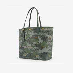 The Daily Battle bag, a Fauré Le Page icon, superbly combines craftsmanship with the finesse of the Maison’s signatures. This practical tote bag is designed to take on all the battles of everyday life and will stand the test of time. For this edition, the Scale Canvas blends into a verdant Camouflage pattern, like a game of hide-and-seek in a French Garden. The corners of the bag, in grained calfskin, are inspired by the corner reinforcements on hunting cases, while piping typical of military u Everyday Luxury Tote Satchel, Luxury Large Capacity Everyday Bag, Daily Use Satchel Tote With Case Included, Daily Use Tote Satchel With Case Included, Shopping Tote Bag With Case Included, Tote Bags With Case For Everyday Use, Everyday Tote Bag With Case Included, Luxury Large Capacity Shoulder Bag For Daily Use, Green Coated Canvas Satchel