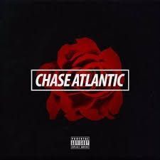 a red rose with the word chase atlantic on it's black and white background