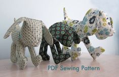 three stuffed animals are lined up on a wooden table with the words pdf sewing pattern below them