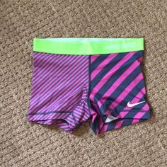 Never Worn Nike Shorts. Elastic Lime Green Band With Pink And Gray Spandex. 80% Polyester 20% Spandex Fitted Pink Activewear With Built-in Shorts, Elastic Pink Sports Bottoms, Nike Stretch Yoga Shorts, Pink Elastic Sports Bottoms, Pink Elastic Short Length Bottoms, Pink Sporty Swimming Shorts, Sporty Pink Swimming Shorts, Pink Elastic Activewear For Workout, Sporty Pink Shorts For Swimming