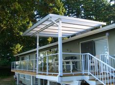 a house with a deck and white railing