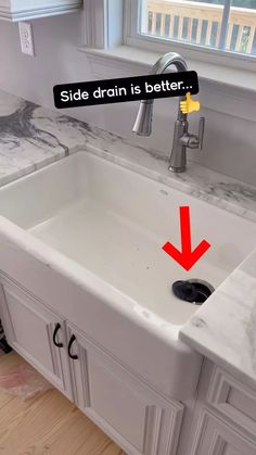 a sink with a red arrow pointing to the side drain that is better above it