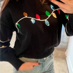 Celebrate The Season With This Stylish Black Sweater Featuring Vibrant Sequin Lights. Perfect For Adding A Festive Touch To Your Holiday Season. *Brand New With Tags -Ribbed Crew Neckline - Long Balloon Sleeve Ribbed Hem - Lightweight * Model Is 5'8, 32-27-37, Wearing Small Long Balloons, Light Sweater, Festive Holiday, Black Sweater, Holiday Lights, Holiday Festival, Black Sweaters, Crew Neckline, Black Color