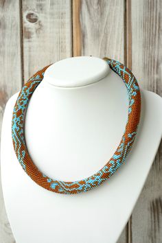 "Amber necklace with turquoise lace pattern... ♡I promise that you will always be in the spotlight with such necklace!♡ SIZE Length: 19 inches (48 cm) ❤ CUSTOM ORDERS It is ABSOLUTELY HANDMADE . So if you like this item in a different color or size, send me a message please. I will send you a link for a \"custom order\" and you'll be able to place the order there. Please feel free to communicate with me. More beautiful necklaces https://www.etsy.com/ru/shop/UkrainianJewelryShop?ref=listing-shop2 Bohemian Brown Crochet Jewelry, Brown Bohemian Crochet Jewelry, Turquoise Lace, Chocker Necklace, Amber Necklace, Lace Pattern, Bead Crochet, Necklace Sizes, Turquoise Beads