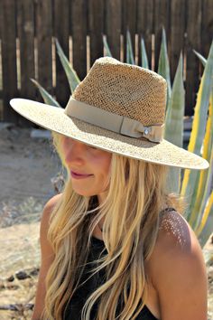 Our Palm Desert Panama fit in perfectly on our latest road trip photo shoot. Stunning, classic, chic - everything you've ever wanted in a hat. Featuring a molded crown with a pinched 10cm brim and hand woven straw, it's crystallized on the tone on tone ribbon with a simple Swarovski rivet. -Rancher style hat with a chill & casual vibe-Brim is flexible but holds its shape-Coordinating ribbon band-Pinched top-Great quality-- will last forever-This color actually goes with everything effortless Elegant Straw Hat With Upf 50+ For Travel, Adjustable Structured Crown Straw Hat For Vacation, Adjustable Straw Sun Hat With Structured Crown, Elegant Woven Straw Hat For Travel, Elegant Natural Straw Hat For Travel, Chic Brimmed Panama Hat For Travel, Chic Travel Hats For Kentucky Derby, Chic Kentucky Derby Straw Hat For Travel, Elegant Straw Boater Hat For Travel