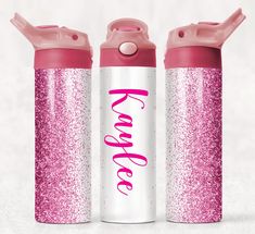 two pink and white water bottles with the word romance written on them, sitting next to each other