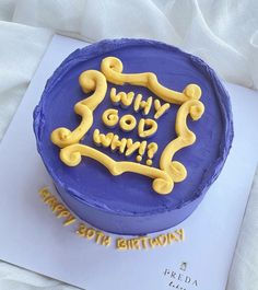 a birthday cake with the words why god am? written on it in yellow icing