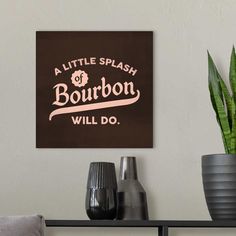 a little splash of bourbon will do sign on the wall next to a potted plant