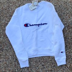 White Jacket With Champion Logo In The Middle White Streetwear Outerwear With Embroidered Logo, Fall White Outerwear With Embroidered Logo, Trendy White Outerwear With Ribbed Cuffs, White Crew Neck Outerwear For Spring, Crewneck Men, Champion Jacket, Champion Crewneck, Champion Logo, Champion Reverse Weave