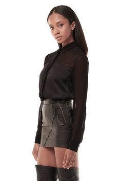 Made to pop, our Sheer Blouse is classic tailored menswear-inspired staple cut from a sexy sheer fabric with patch pocket detailing at the chest and clean button closures up the front and at cuffs. — Classic collar— Button closures up the front and at cuffs— 100% viscose SIZE + FIT— Fitted collared shirt— Model is 5’8 and wearing a size SCARE— Dry clean only Classic Sheer Button-up Tops, Black Sheer Button Up Blouse, Chic Sheer Button-up Blouse, Black Button-up Blouse With Back Button Closure, Black Sheer Sleeves Button-up Blouse, Sheer Blouse, Menswear Inspired, Pocket Detail, Sheer Fabrics