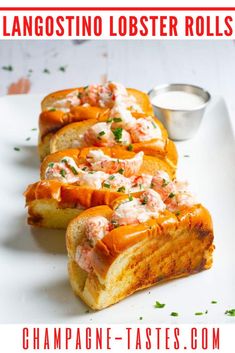 lobster looster rolls on a white platter with dipping sauce in the background