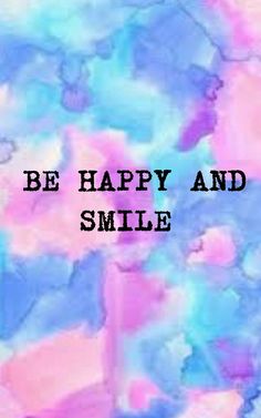 the words be happy and smile are painted in blue, pink, and purple colors