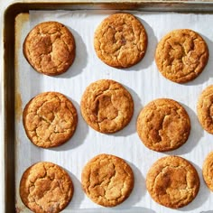 twelve freshly baked cookies are on a baking sheet, ready to be cooked in the oven