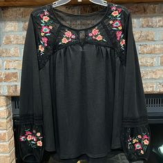 Time And Tru Women’s Embroidered Peasant Top. Black With Colorful Floral Embroidered Design On Front And Sleeves. Polka Dot Sheer Upper Back And Under All Embroidered Areas. Brand New Condition, Was Never Worn. Size Xl (16-18). Lying Flat, Pit To Pit Measures 24 1/2” Across, 28” Long. From Smoke Free And Pet Free Home. Black Tops With Embroidered Sleeves For Fall, Black Tops With Embroidered Hem For Fall, Casual Black Embroidered Top For Spring, Casual Black Top With Embroidered Hem, Black Bohemian Peasant Top For Fall, Black Long Sleeve Embroidered Top For Fall, Black Embroidered Long Sleeve Top For Fall, Black Embroidered Hem Blouse For Spring, Black Blouse With Embroidered Hem For Spring