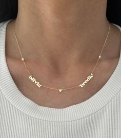 This adorable mini name necklace now comes with diamonds in between each name! Price is based on how many names you enter. Goes up as you enter more names. Example: if entering 4 names, select 4 for # of names. If you want to order one with a date, please use dashes ONLY in between the numbers. EXAMPLE: 14K Yellow Gold, 3 names, 4 diamonds - $1600 Name #1: zoey Name #2: max Name #3: jagger 2 names: 1 or 3 diamonds - if 1 it will be in between the name, if 3 it will be on every side of the names Diamond Nameplate Necklaces, Customizable Diamond Name Necklace For Personalized Gift, Customizable Diamond Nameplate Necklace, Custom Name Diamond Necklace For Anniversary, Customized Diamond Name Necklace, Customized Elegant Diamond Name Necklace, Anniversary White Gold Name Necklace, White Diamond Nameplate Necklace, Personalized Diamond Name Necklace In White