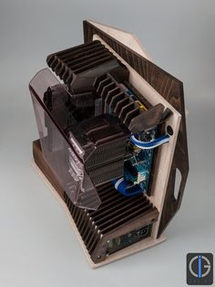 the inside of a computer case that is made out of wood and plastic with multiple components in it